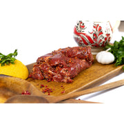 Raw frozen sheep pastrami from DELUMANI, sliced and ready for cooking, part of the artisanal cold cuts and deli meats collection.