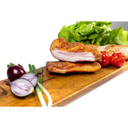 Smoked homemade pork neck from DELUMANI, sliced thin, showcasing its rich texture and golden smoked exterior.